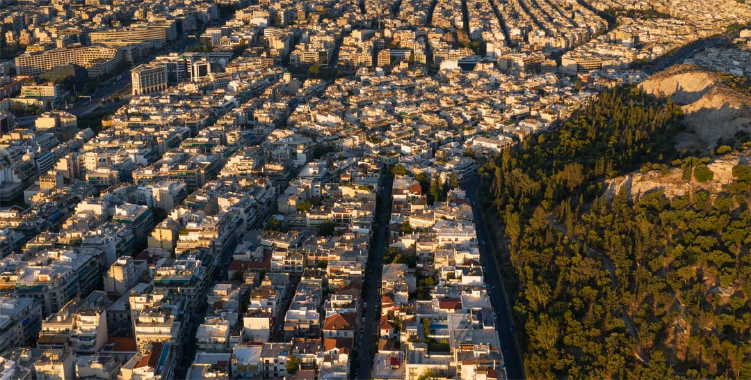 Above the rooftops of Athens view from the Acropolis looking toward the Saraonic Gulf - click to expand and enlarge Above the rooftops of Athens view from the Acropolis looking toward the Saraonic Gulf